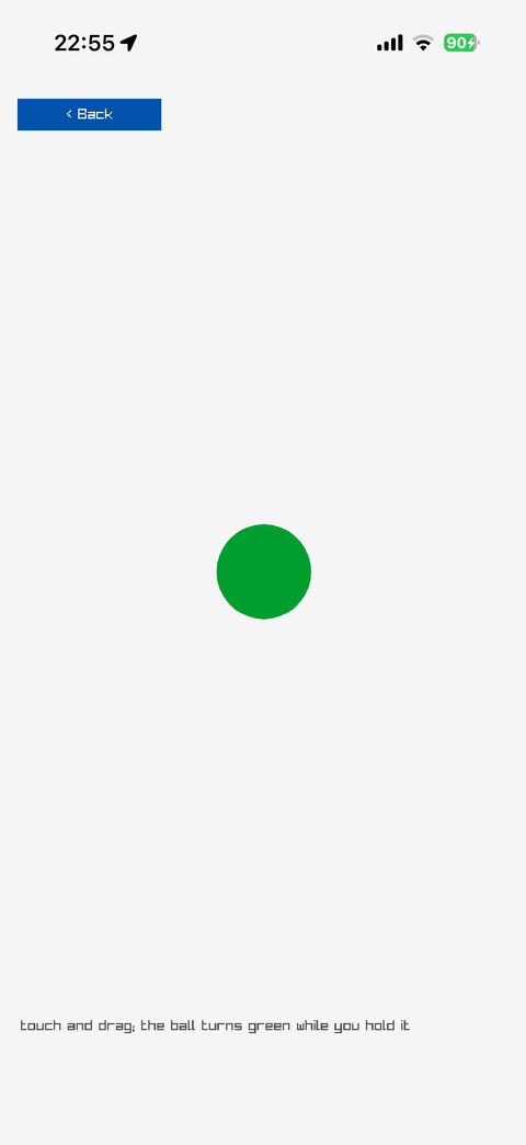 A green ball under a finger
